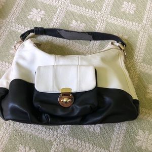 Black and white shoulder bag. Fair condition. Pet and smoke free home.
